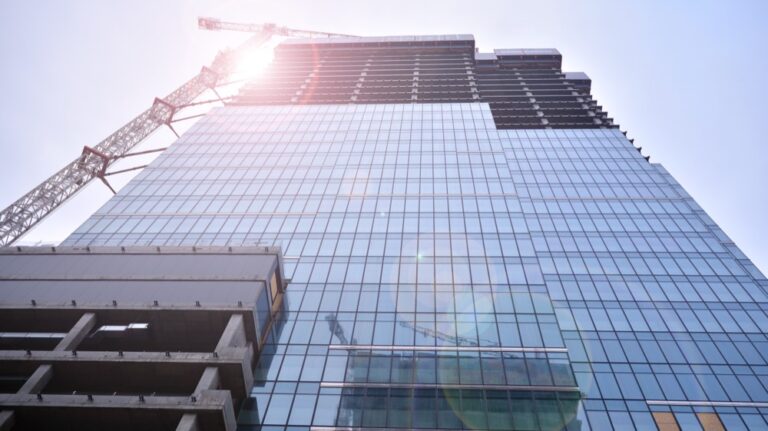 High-rise glass tower under construction